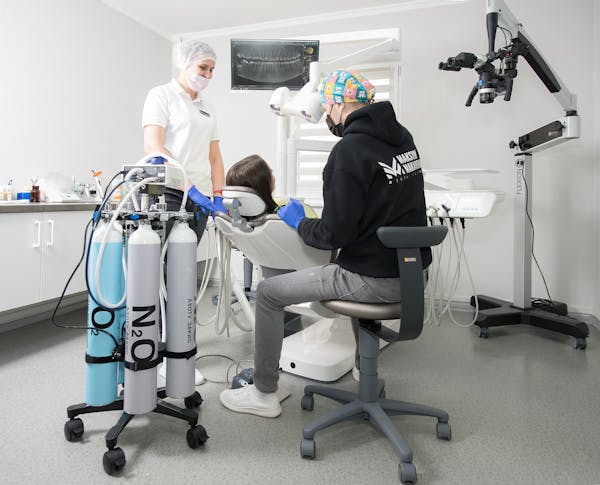 dental professionals treating a patient