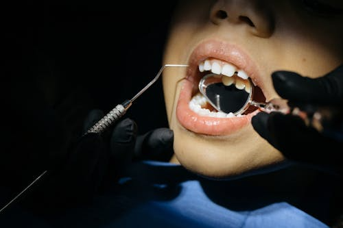a child having his tooth checked-out