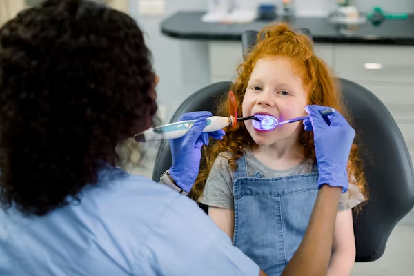 a little girl having a dental treatment